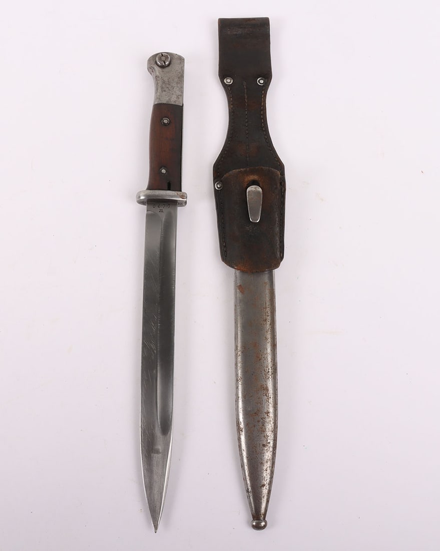 German Bayonet and Frog for K98 Rifle, 1938: German Bayonet and Frog for K98 Rifle, 1938, Nice original K98 bayonet with scabbard and 1936 dated leather frog. The blade is in nice condition with makers mark ‘W.K.C’ and ’38, waf