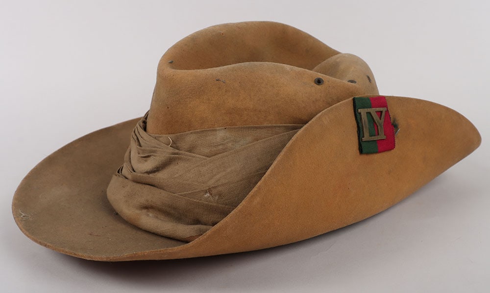 Rare Boer War Imperial Yeomanry Slouch Hat: Rare Boer War Imperial Yeomanry Slouch Hat, light tan felt slouch hat with brass IY on green / maroon ribbon pagri badge to the side flap. Cloth fold pagri to the centre. Three small eyelet vent holes