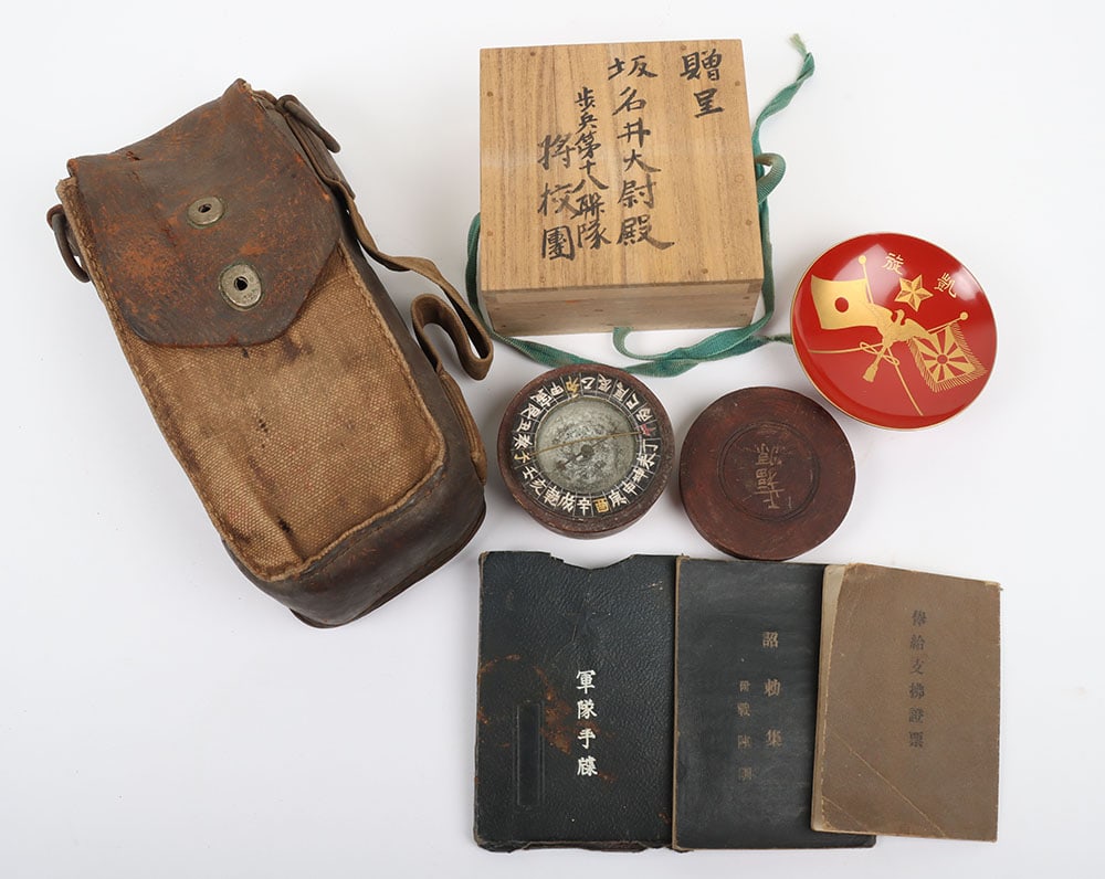 WW2 Japanese Equipment: WW2 Japanese Equipment: Type 96/99 machine gun pouch, patriotic dish in box with writing to outside, wooden cased compass and booklets. 4 items