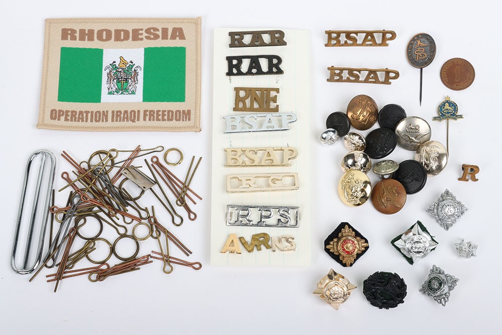 Small selection of Rhodesia shoulder titles buttons, pins and badges of Rank: Small selection of Rhodesia shoulder titles buttons, pins and badges of Rank. Lot includes shoulder titles for the Royal African Rifles, Royal Nyasaland Engineers & The British South African Police. V