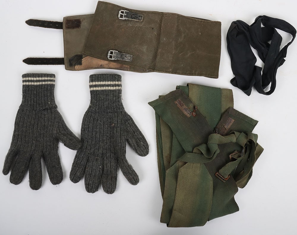 WW2 German Military Tie: WW2 German Military Tie: Black cotton tie stamped inside RB-Nr, 0/0314/0010 F43 with a pair of putties with makers labels, mismatch pair of gaiters and pair of army gloves. 4 items