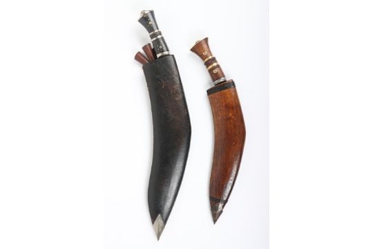 Indian (Gurkha) Kukri: Indian (Gurkha) Kukri, with wooden grip having brass studs, brass pommel cap and housed in wooden scabbard with steel bottom chape. Curved steel Kukri blade with two blood groves to the top. Blade 30c