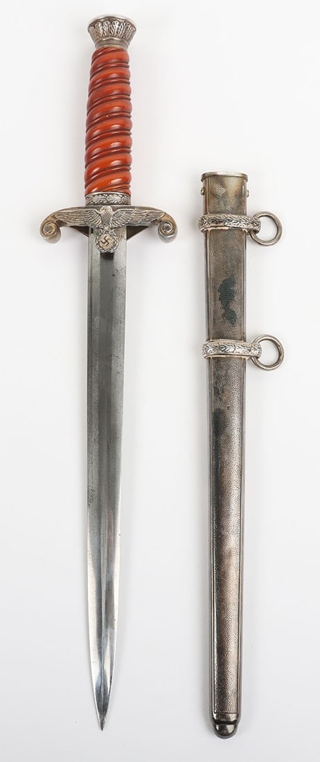 WW2 German Army Officers Dress Dagger by Carl Eickhorn, Solingen: WW2 German Army Officers Dress Dagger by Carl Eickhorn, Solingen, good example with deep orange celluloid grip, pommel top with oakleaves relief, cross guard in form of army eagle with swastika. House