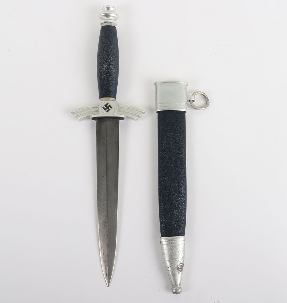 Third Reich NSFK Flyers Knife Dagger by F&A Helbig: Third Reich NSFK Flyers Knife Dagger by F&A Helbig, good example with aluminium fittings and blue leather covering to the grip and scabbard. Black enamel to the central swastikas. Screws missing from