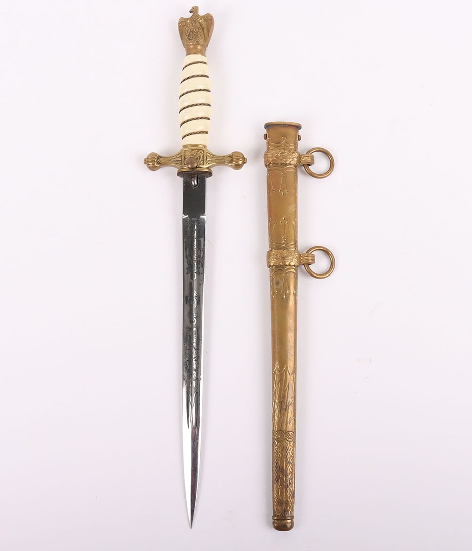 WW2 German Kriegsmarine Officers Dress Dagger by WKC: WW2 German Kriegsmarine Officers Dress Dagger by WKC, standard example with white celluloid grip having the wire binding. Eagle pommel top and cross guard with press release button. Standard pattern b