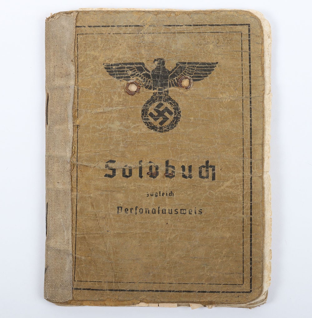 WW2 German Army Soldbuch Signals Unit: WW2 German Army Soldbuch Signals Unit , well used German army soldbuch with defaced uniform photograph to the inside front cover. The book was issued to Heinrich Prusse in 1941. Various promotions to 