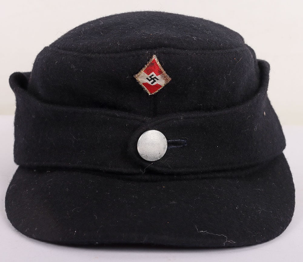 Hitler Youth Winter M-43 Field Cap: Hitler Youth Winter M-43 Field Cap, of black wool with machine embroidered HJ diamond insignia to the centre. Single button front. Interior with black cloth lining having linen RZM label.