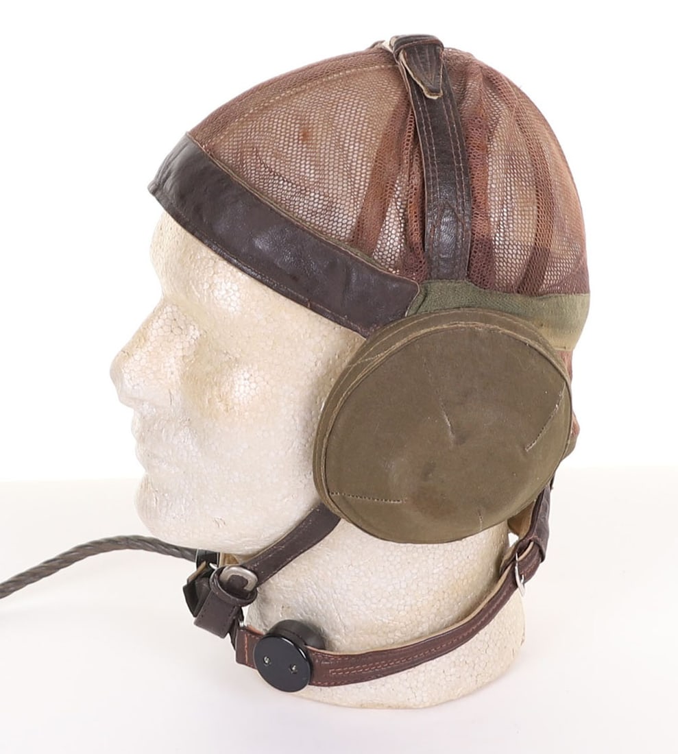 Variation of Luftwaffe LKpN 101 Flying Helmet: Variation of Luftwaffe LKpN 101 Flying Helmet, unusual example of the netted Luftwaffe flying helmet with green cloth covered internal earphone cups, green cloth back strap cloth, top with leather cro