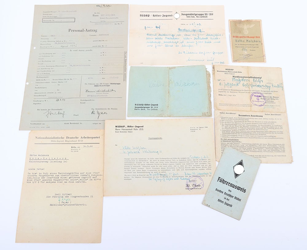 Third Reich BDM Paperwork grouping to Kathe Malzkorn, BDM leader, late war 1944: Third Reich BDM Paperwork grouping to Kathe Malzkorn, BDM leader, late war 1944. Group contains the BDM leader identify card with photo, letter for BDM dress , order for special duties in case of air 