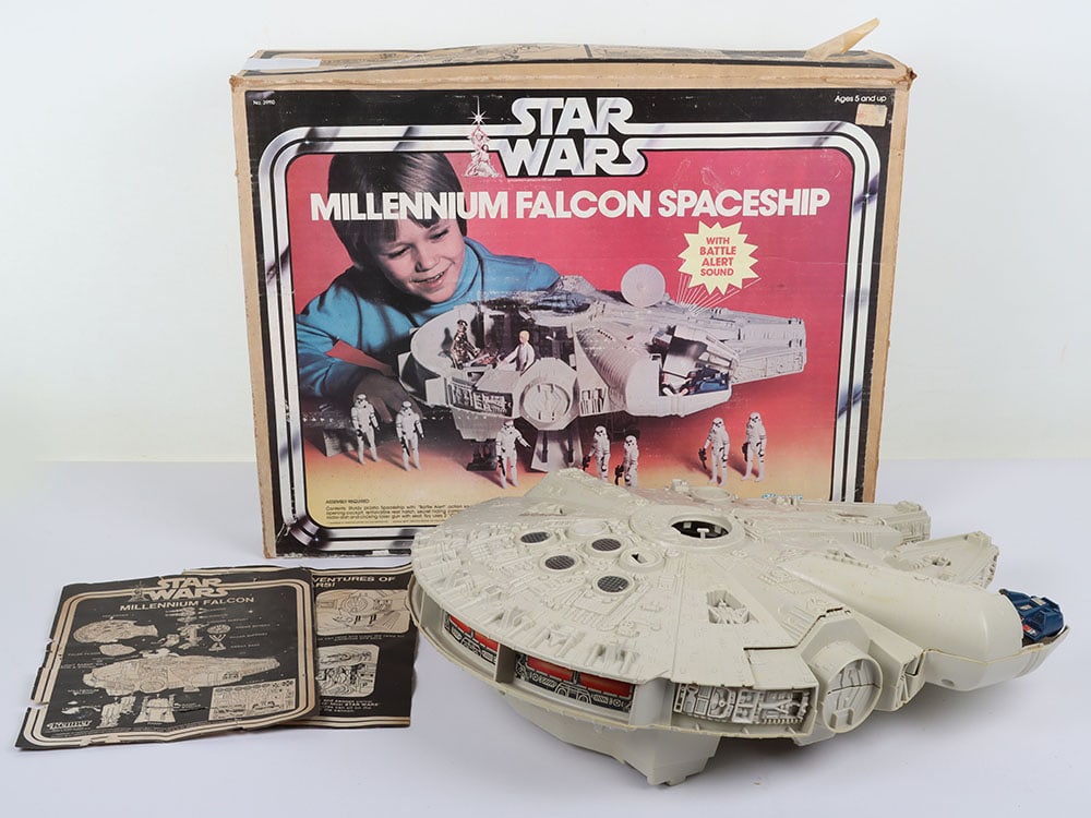 Vintage Star Wars Millenium Falcon Boxed Kenner.: Vintage Star Wars Millenium Falcon Boxed Kenner. Product code 39110. Box has wear, water damage and white tape down one side. Complete. Does have some discolouration. Instruction sheet is damaged. Unt