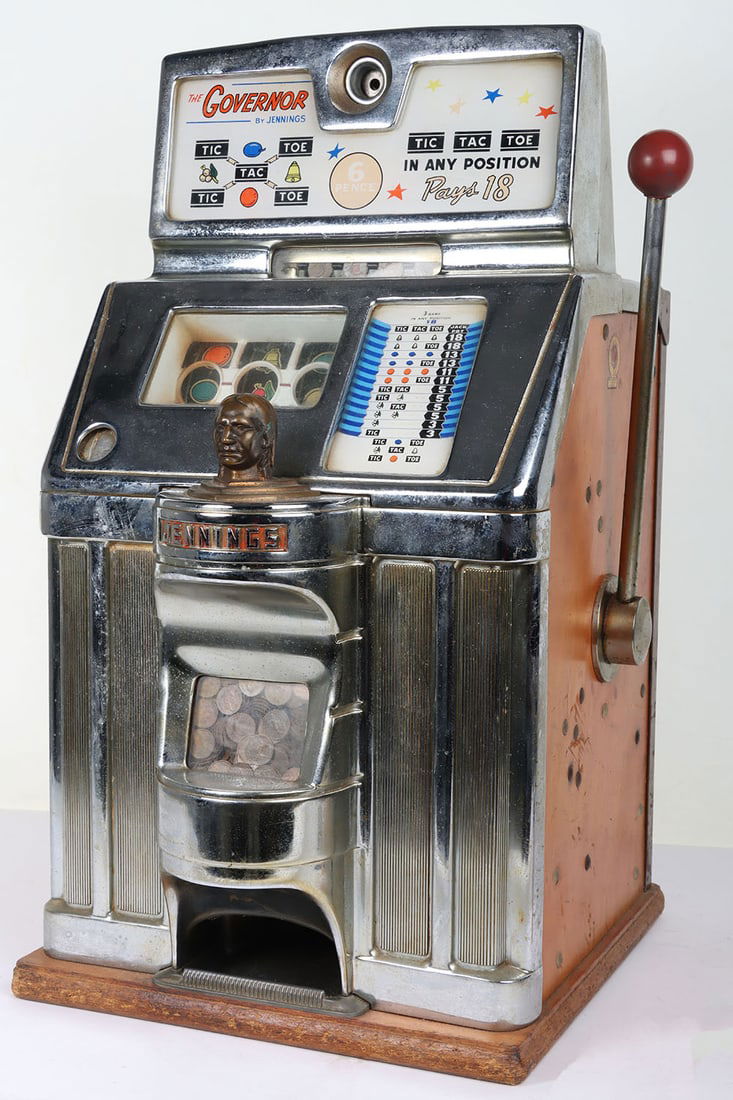 O.D. Jennings 'The Governor' 1961 One Arm Bandit Slot Machine.: O.D. Jennings 'The Governor' 1961 One Arm Bandit Slot Machine. 6d play. Original back door with keys. Measurements approx. 28" height, 17" width, 16" depth. Has been converted to take 1 pence coi