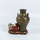 Gold and silver rockery conjoined bottle with tea at the end