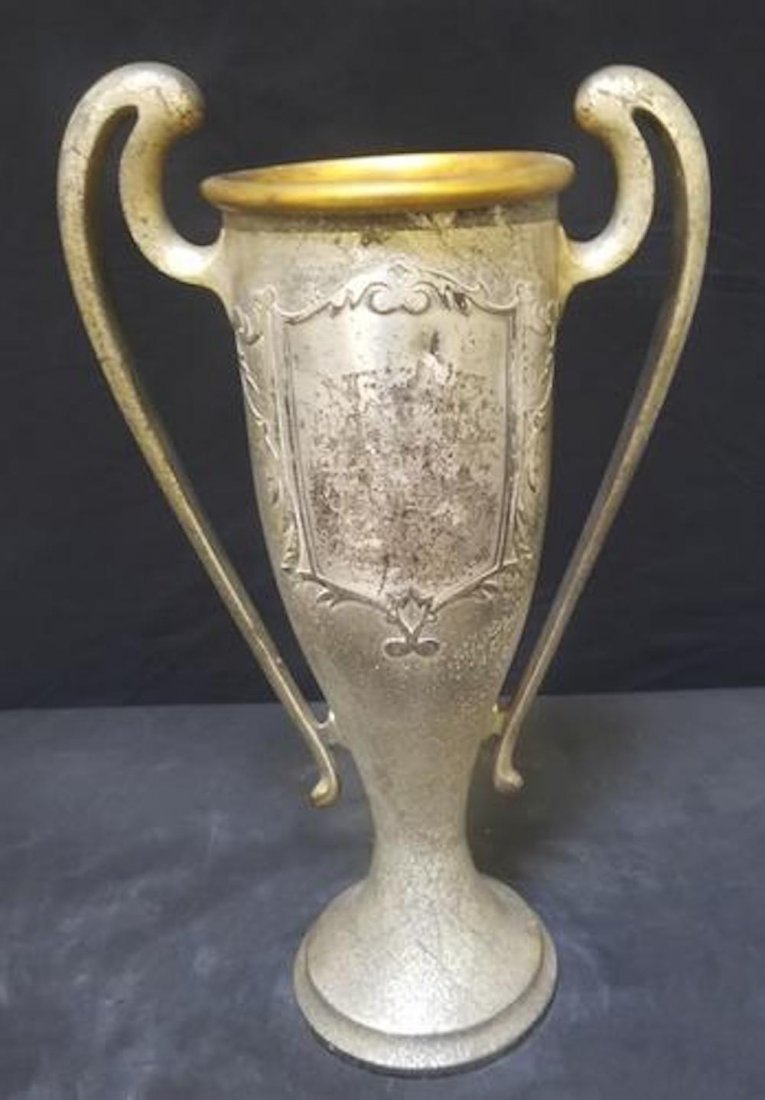 Vintage Sterling on Bronze Trophy: Vintage Sterling on Bronze "Silvercrest" Trophy.Beautiful and decorative vintage trophy.Stamped and numbered on the bottom. Letters are faded due to it's age.Needs cleaning and polishing.Approximate s