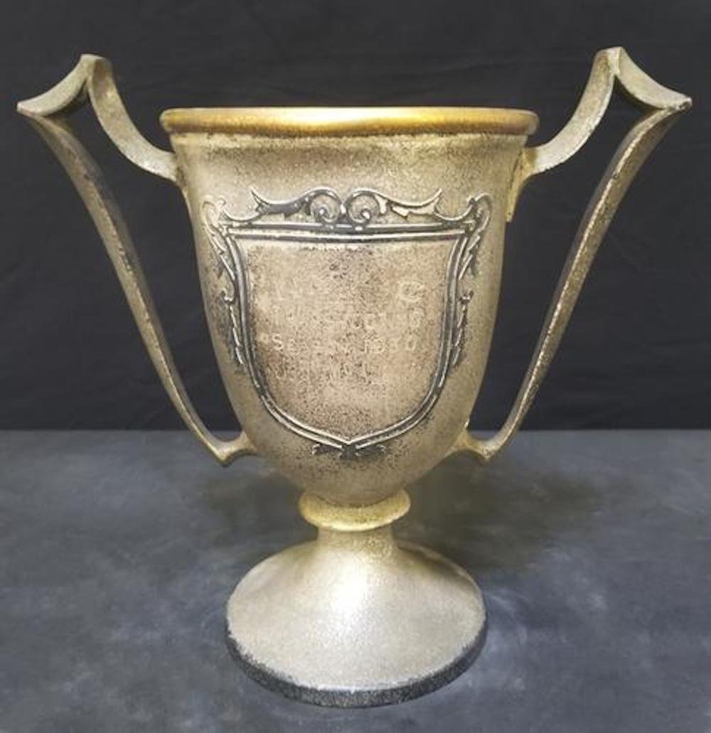 Vintage Sterling on Bronze Trophy: Vintage Sterling on Bronze "Silvercrest" Trophy.Beautiful and decorative vintage trophy. Stamped and numbered on the bottom.Letters are faded due to it's age.Needs cleaning and polishing.Approximate s