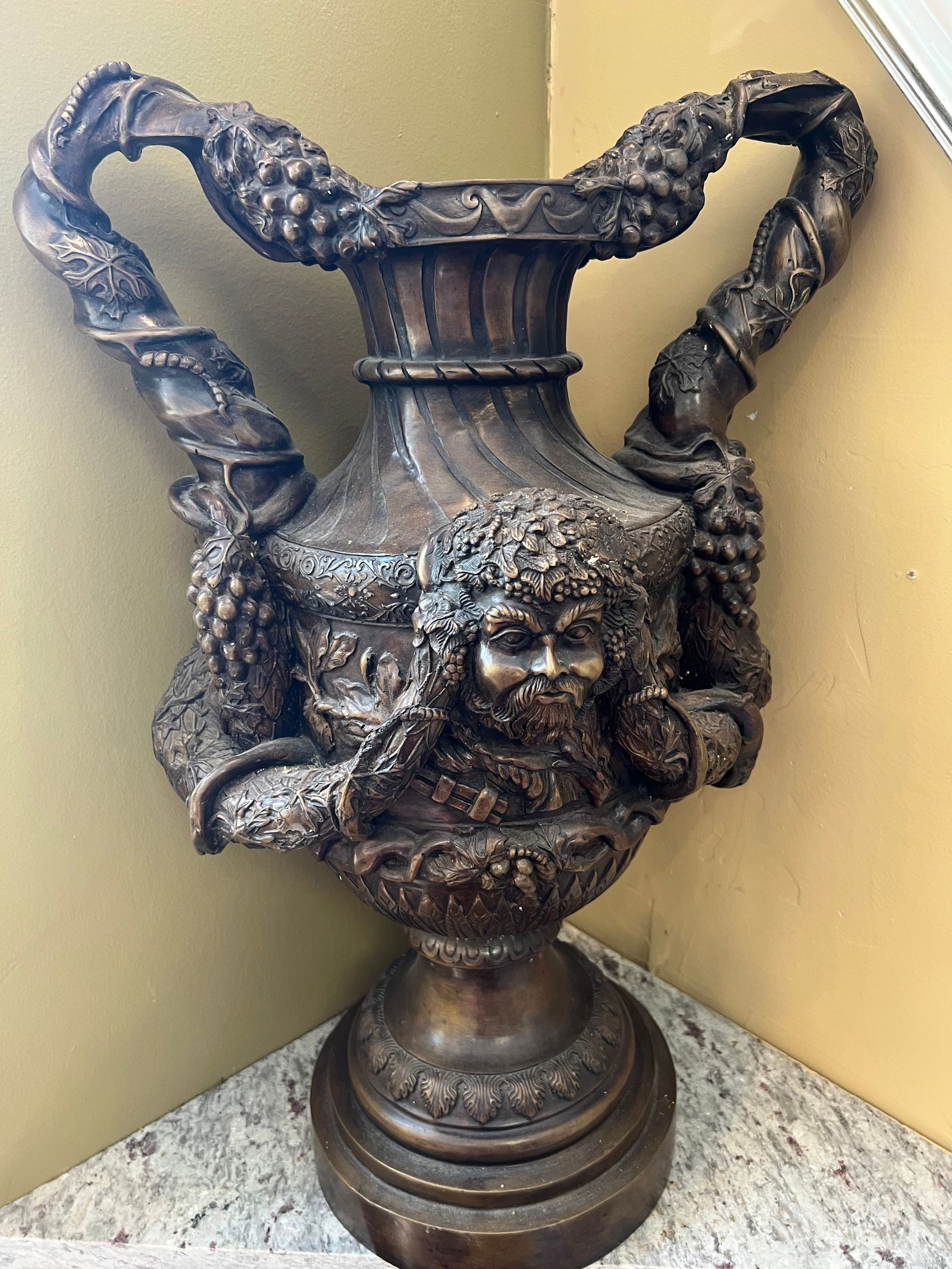 Impressive Mid-19th Century Bronze Urn with Bacchic Motif - 26" Height: Presenting a substantial and richly detailed mid-19th century bronze urn, a remarkable example of historical metalwork. Standing at an impressive 26 inches in height with a width of 17 inches and a de