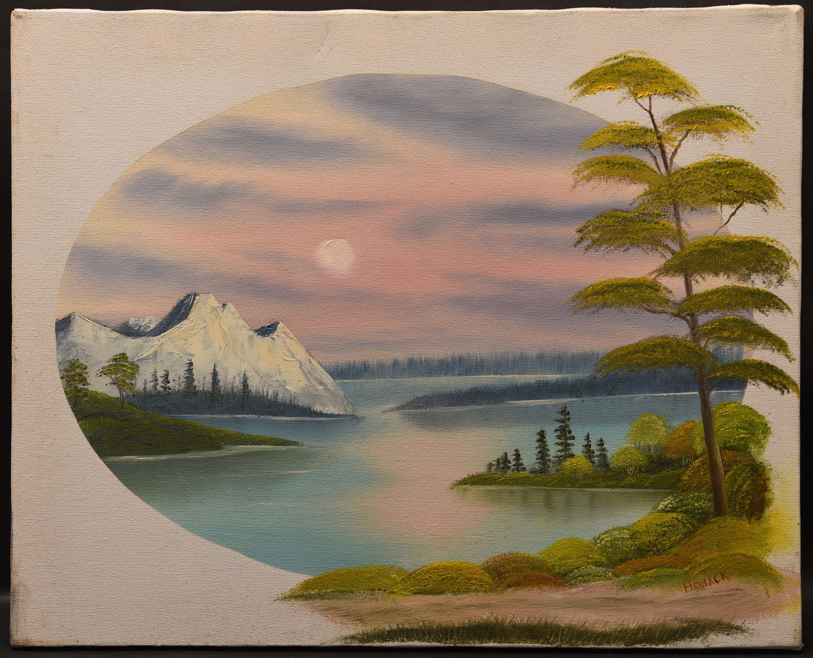 Alpine Sunset Oil On Canvas: This enchanting painting by Hoback captures a serene alpine landscape bathed in the warm glow of a setting sun. A circular frame draws attention to the scene, emphasizing the panoramic view. In the