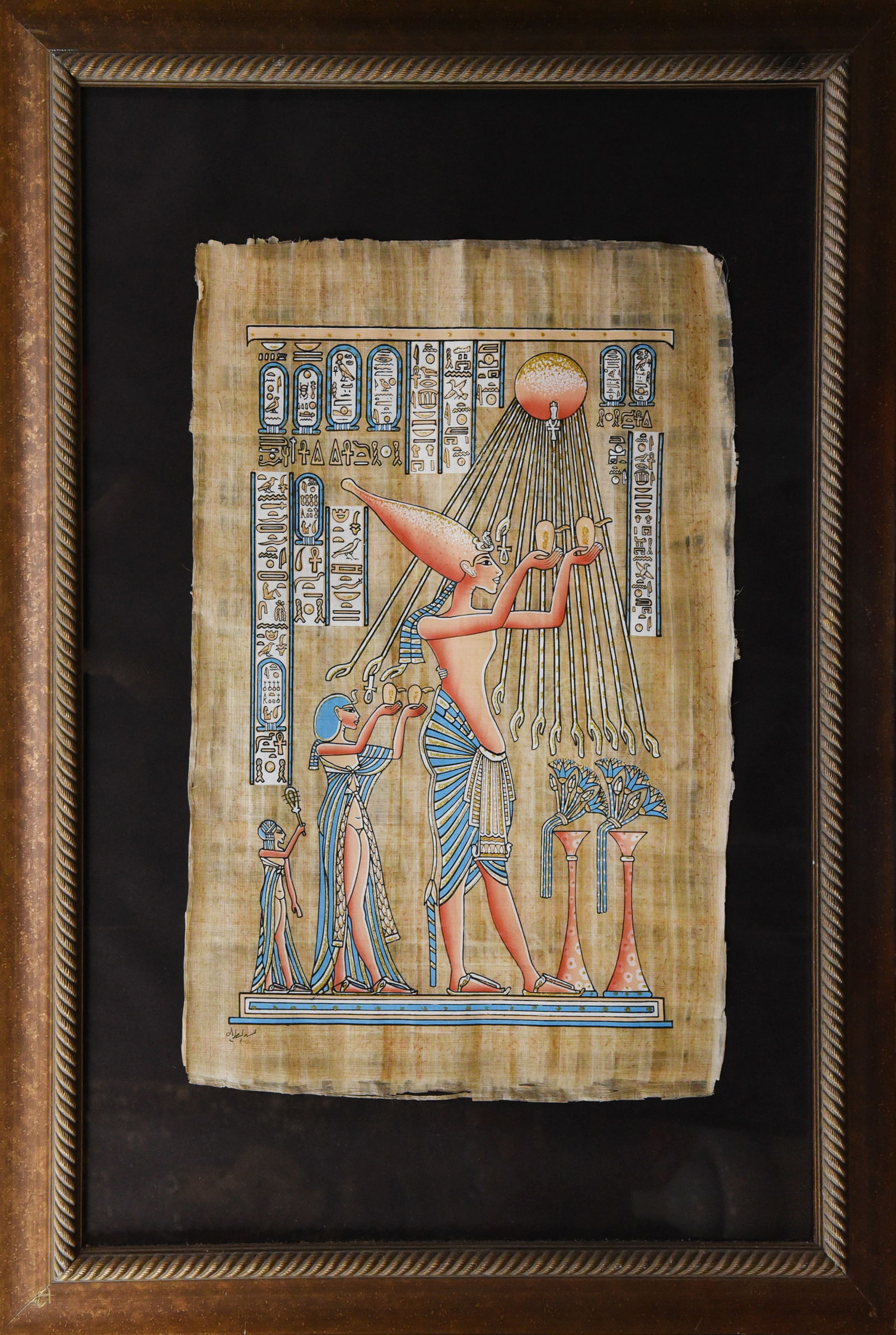 Royal Worship: Akhenaten and Nefertiti Papyrus Art: Experience the splendor of ancient Egypt's Amarna period with this captivating papyrus artwork. Measuring 28" x 39", this piece depicts the pharaoh Akhenaten and his queen Nefertiti in a moment of