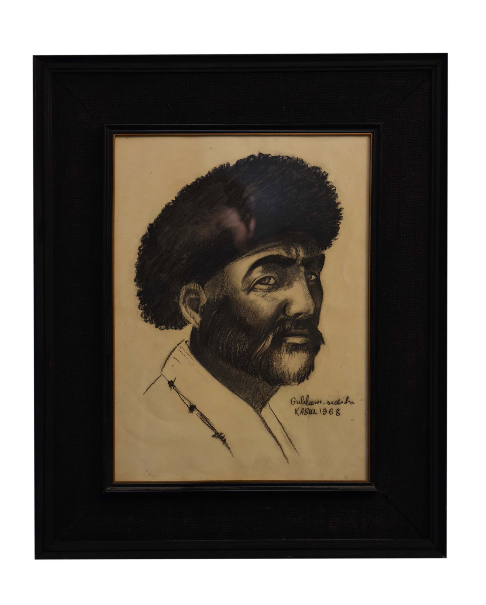 Portrait in Astrakhan Hat Charcole Painting By Ghulam Sedik: This impactful 21" x 27" charcoal drawing by Ghulam Sedik, created in Kabul in 1969, presents a compelling portrait of an individual adorned in what appears to be an astrakhan or karakul-style hat. Th
