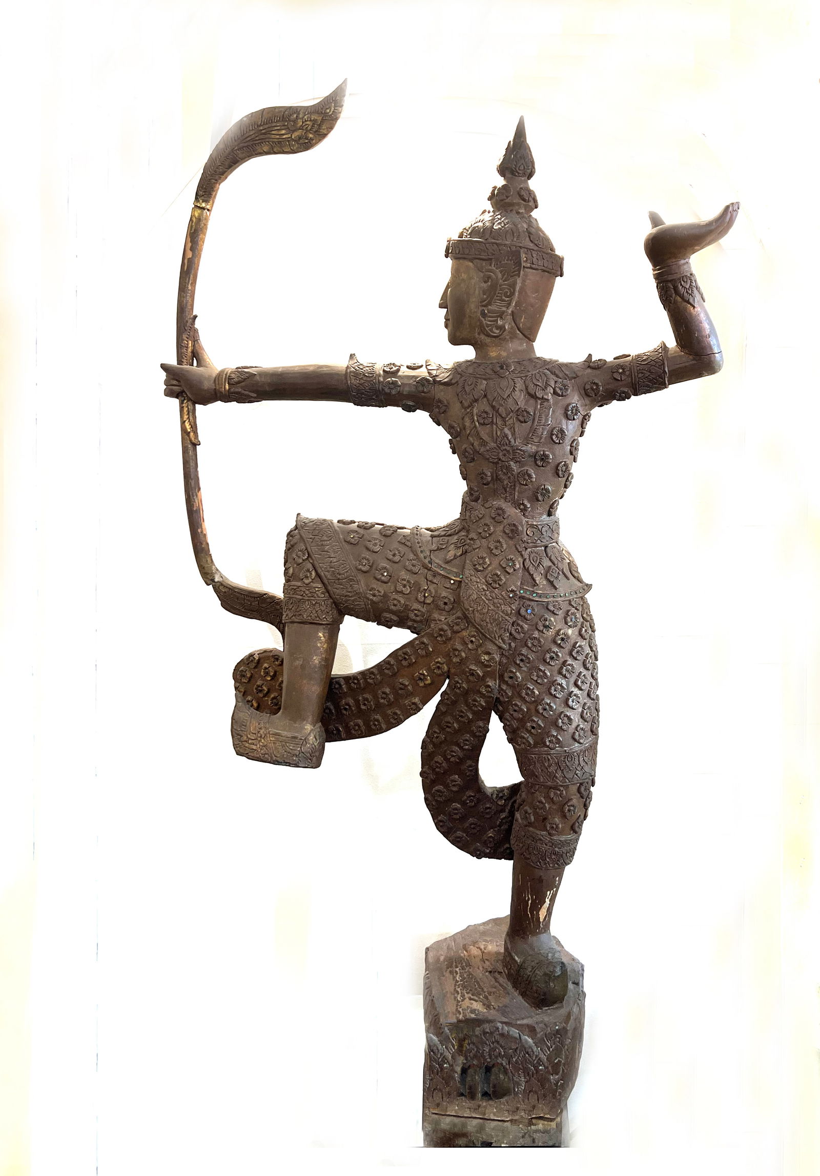 Antique Grand Thai Teakwood Archer: Prince Phra Ram: This impressive and heavy-set antique sculpture, standing 60" tall, is hand-carved from solid cedar (traditionally referred to as Thai teak in similar Southeast Asian contexts). It depicts a noble arc
