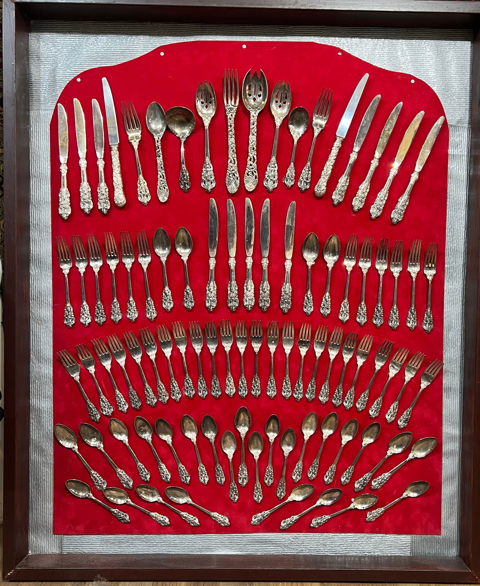 Large Vintage Silver-Plated Flatware Service | 82-Piece Set in Custom 37" x 47" Shadow Box: Elevate your dining room decor with this stunning, wall-mounted presentation of vintage silver-plated flatware. This extensive collection features an intricate, ornate floral pattern on the handles, o