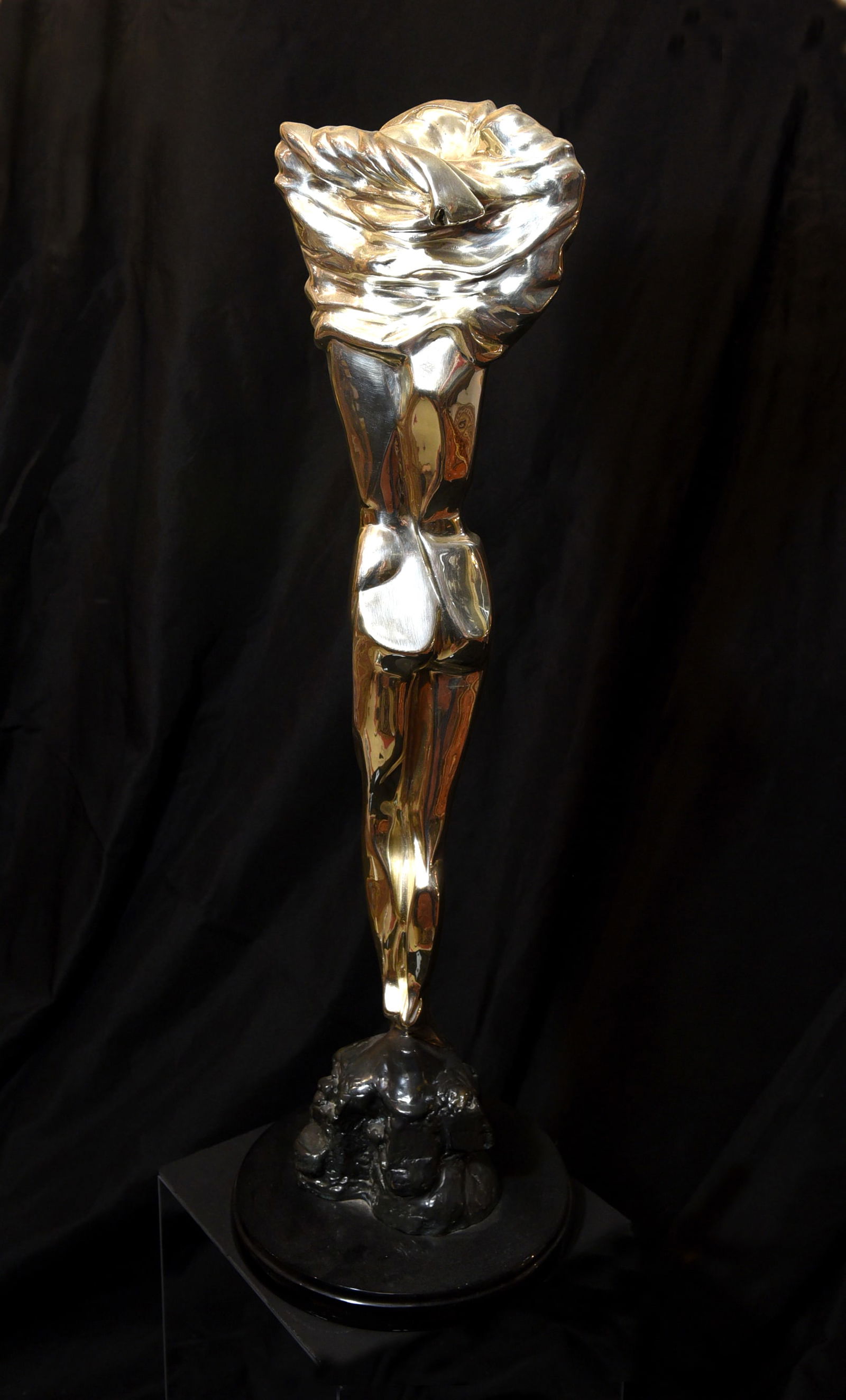 Glad" Silver Sculpture by Oshia, Limited Edition (45/500): A striking silver sculpture titled "Glad" by artist Oshia. This limited edition piece (number 45 of 500) features a stylized, elongated female figure with a gracefully draped head covering. The
