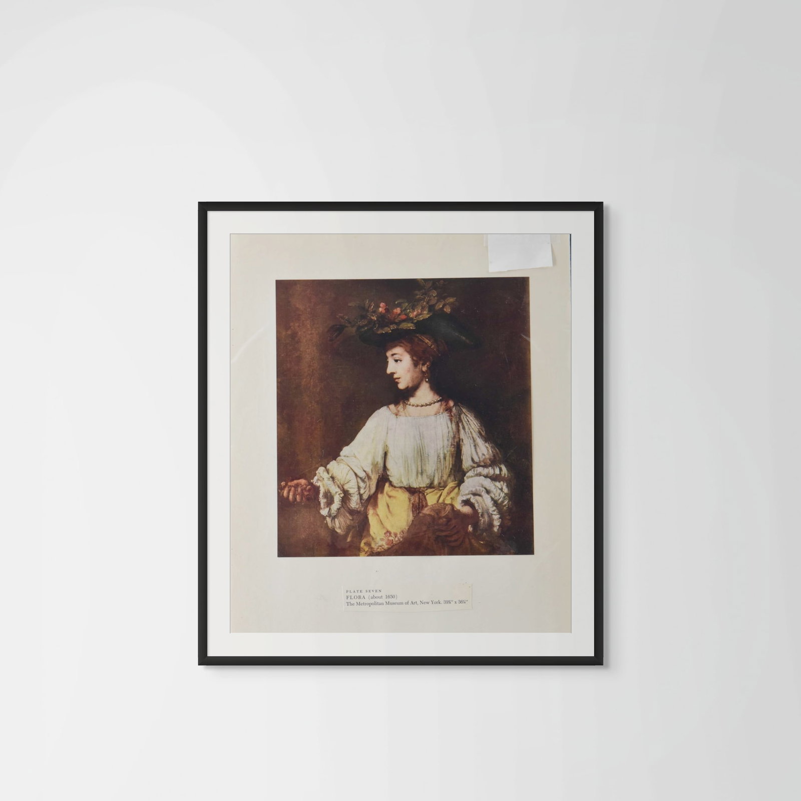 Rembrandt "Flora" (c. 1650) – Museum Art Print from The Metropolitan Museum of Art: This professional museum art print depicts one of Rembrandt’s most celebrated mythological portraits, "Flora." The subject is shown in a pastoral, three-quarter view, wearing a wide-brimmed hat ador