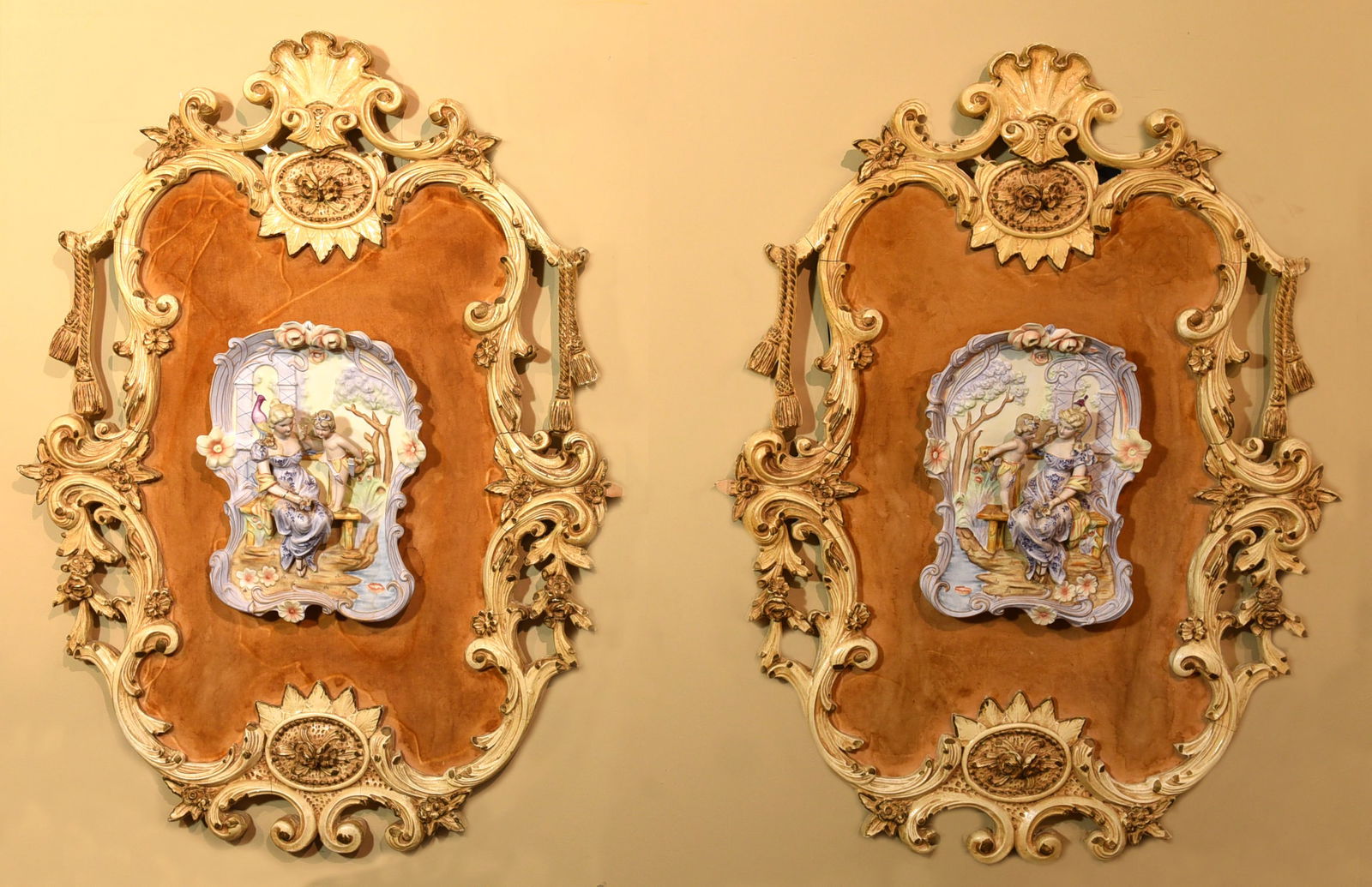 Antique Austrian Hand-Painted Porcelain Plaques in Ornate Frames: A pair of exquisite antique Austrian porcelain plaques, each featuring delicate hand-painted scenes in the Rococo style. The intricate details of the figures and landscapes are a testament to the skil