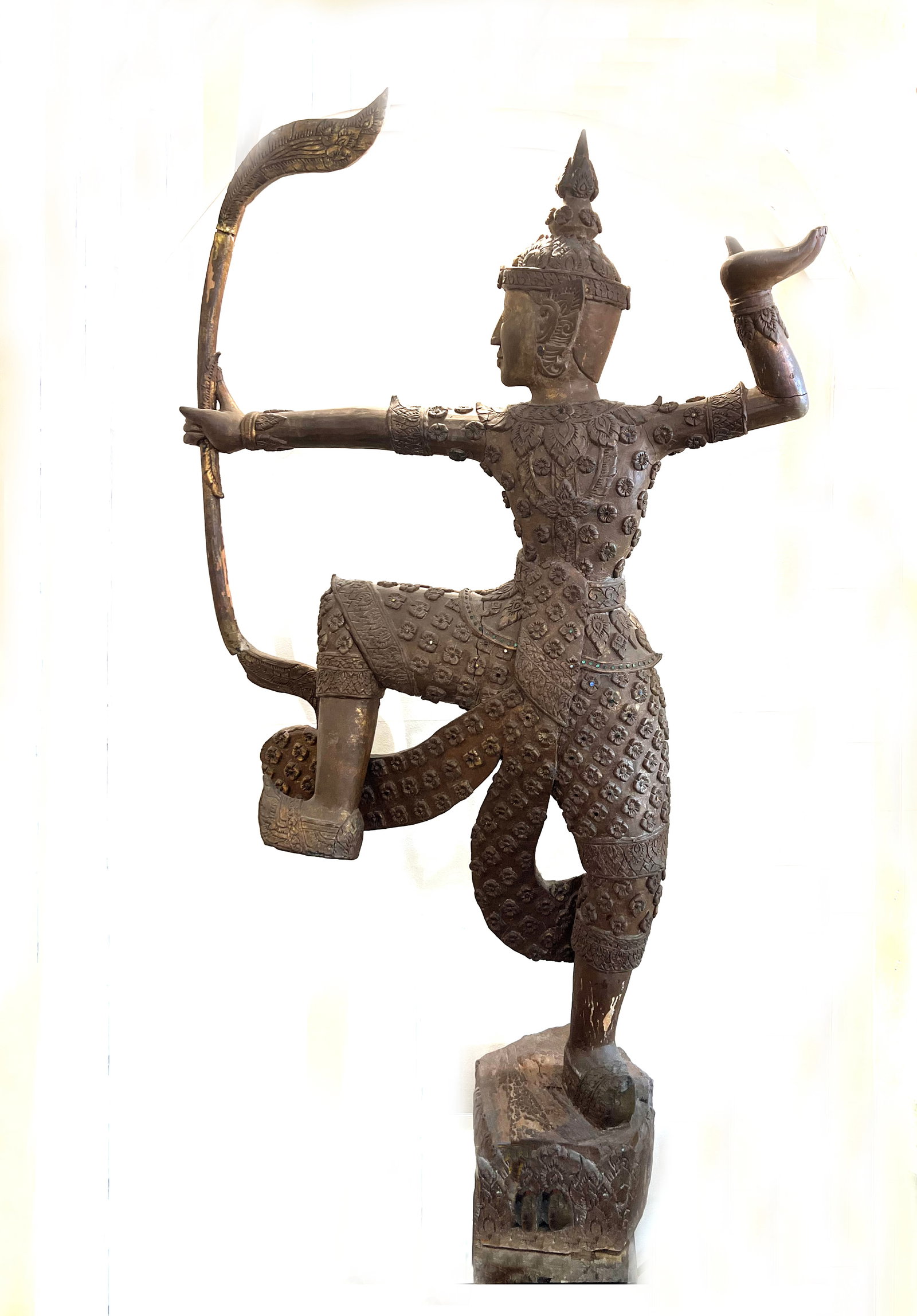 Antique Grand Thai Teakwood Archer: Prince Phra Ram: This impressive and heavy-set antique sculpture, standing 60" tall, is hand-carved from solid cedar (traditionally referred to as Thai teak in similar Southeast Asian contexts). It depicts a noble arc