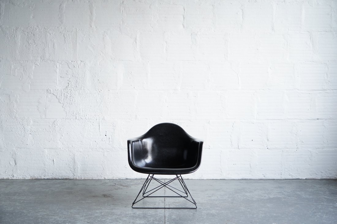 Modernica Eames Fiberglass Armchair on Low Rod Base: The iconic Eames molded fiberglass armchair. Manufactured by Modernica. Dimensions: 32"W | 32"D | 26"H | 12" Seat Height
