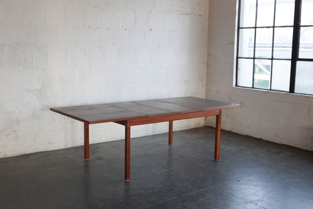 Harry Lunstead Brass Top Dining Table: Unique brass topped dining table with leafs. Patina-ed in house by the TGM team. Designed by Harry Lunstead in USA 1960s. Dimensions: 41"W | 29"H | 60"L | 98" L with leafs. Material: Brass, Walnut.