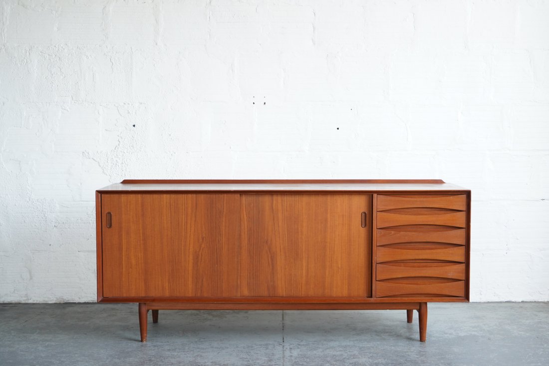 Reversible Door Arne Vodder Credenza: Who doesn't love options? This teak credenza has reversible doors. Designed by Arne Vodder in the 1960s. Dimensions: 71.5"L | 19.5"D | 30"H
