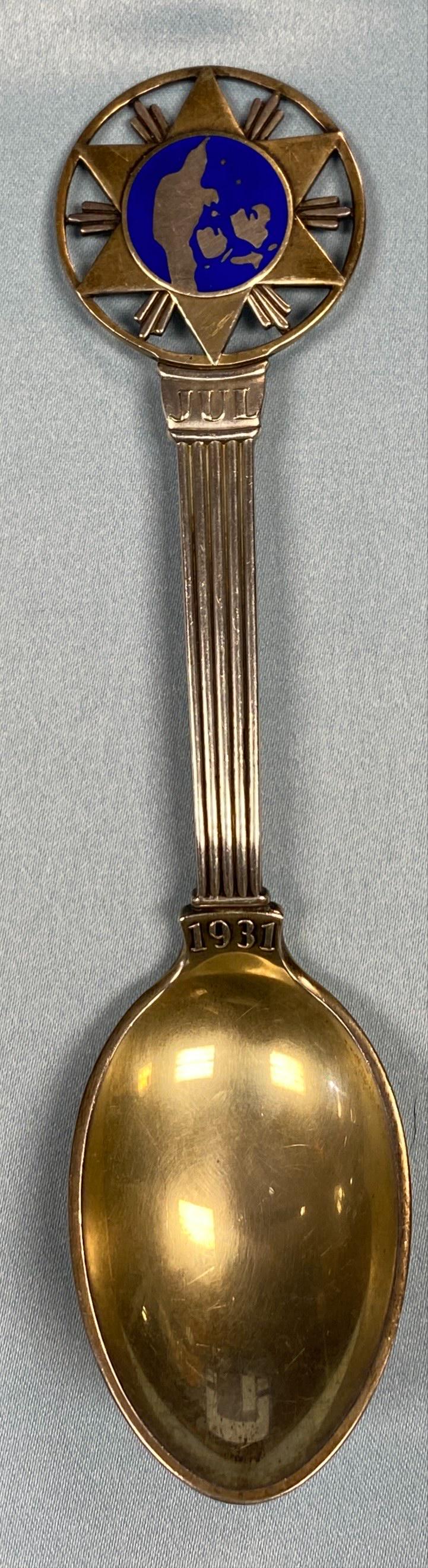 1931 Christmas Themed Spoon Sterling Silver: Danish sterling silver gilt Christmas spoon for 1931, Star of Bethlehem, in blue enamel on a gilt background and a gilt bowl by A. Michelsen of Copenhagen, Denmark. Dimensions: Spoon Lengt