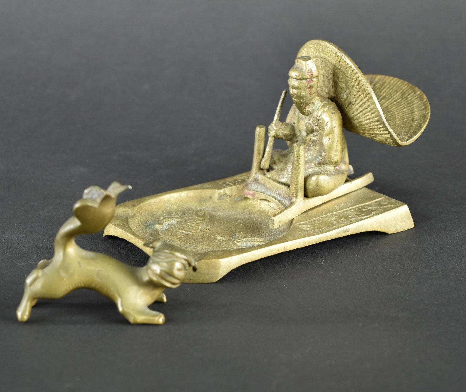 Opium pipe rest and Mythical Dog Opium weight: The pipe rest is 3” x 4 ½” x 3” tall. It is marked KOREA, and cast bronze. It is most likely early 20th century. The opium weight is cast bronze and 2 ½ x 1” x 2̶