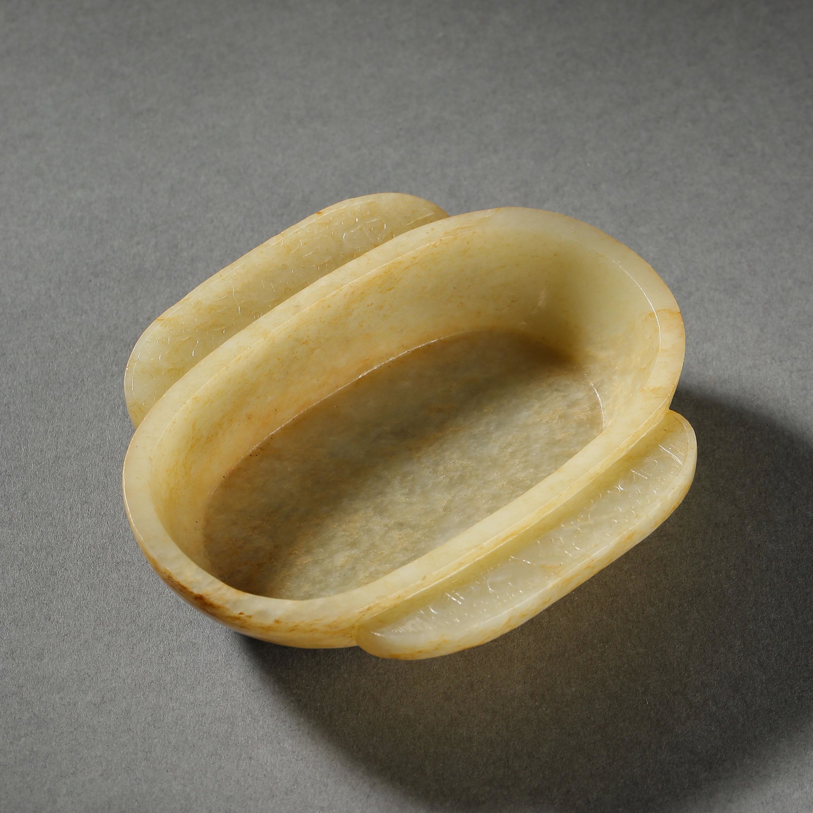 HAN DYNASTY, CHINESE HETIAN JADE EAR CUP: HAN DYNASTY, CHINESE HETIAN JADE EAR CUP L. 10 cm. W. 8.35 cm.