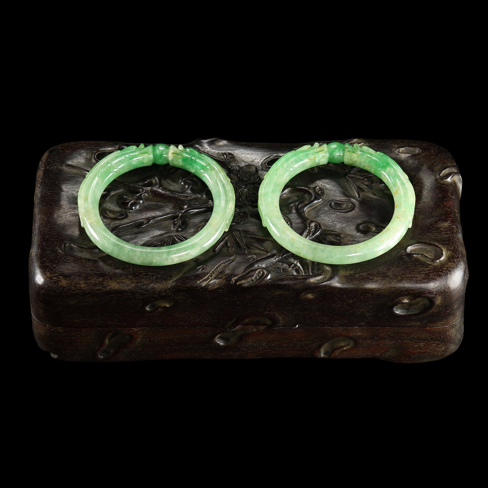 A PAIR OF QING DYNASTY JADE DRAGON PATTERN BRACELETS (1 of 16)