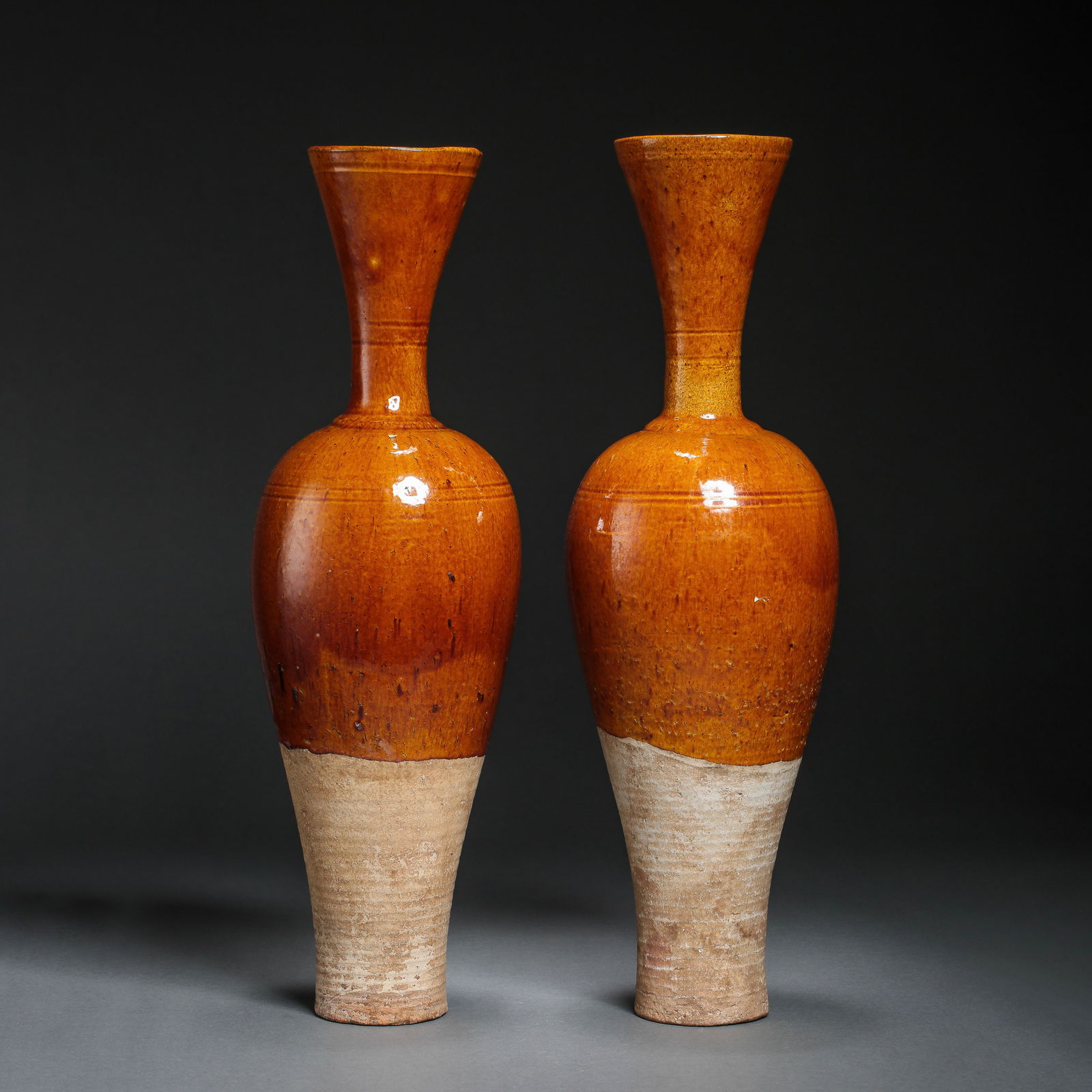 A pair of yellow-glazed flasks from the Liao Dynasty: H. 38 cm.