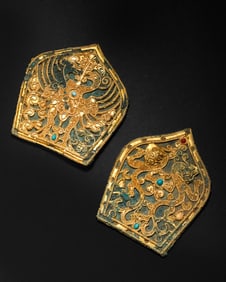 A pair of pure gold and gem-inlaid copper hat crowns from the Han Dynasty of China
