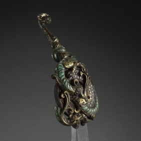 Belt hook with gold and silver inlaid gemstones from the Warring States Period, China
