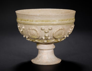 Celadon drum nail plastered high foot cup with hufigure face, Xiangzhou ware, Sui Dynasty, China