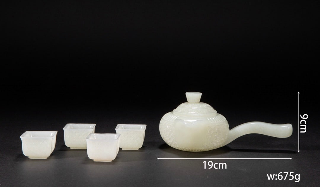 A group of white jade tea sets from Chinese Qing Dynasty Hotan: H. 64 cm. W. 65 cm.