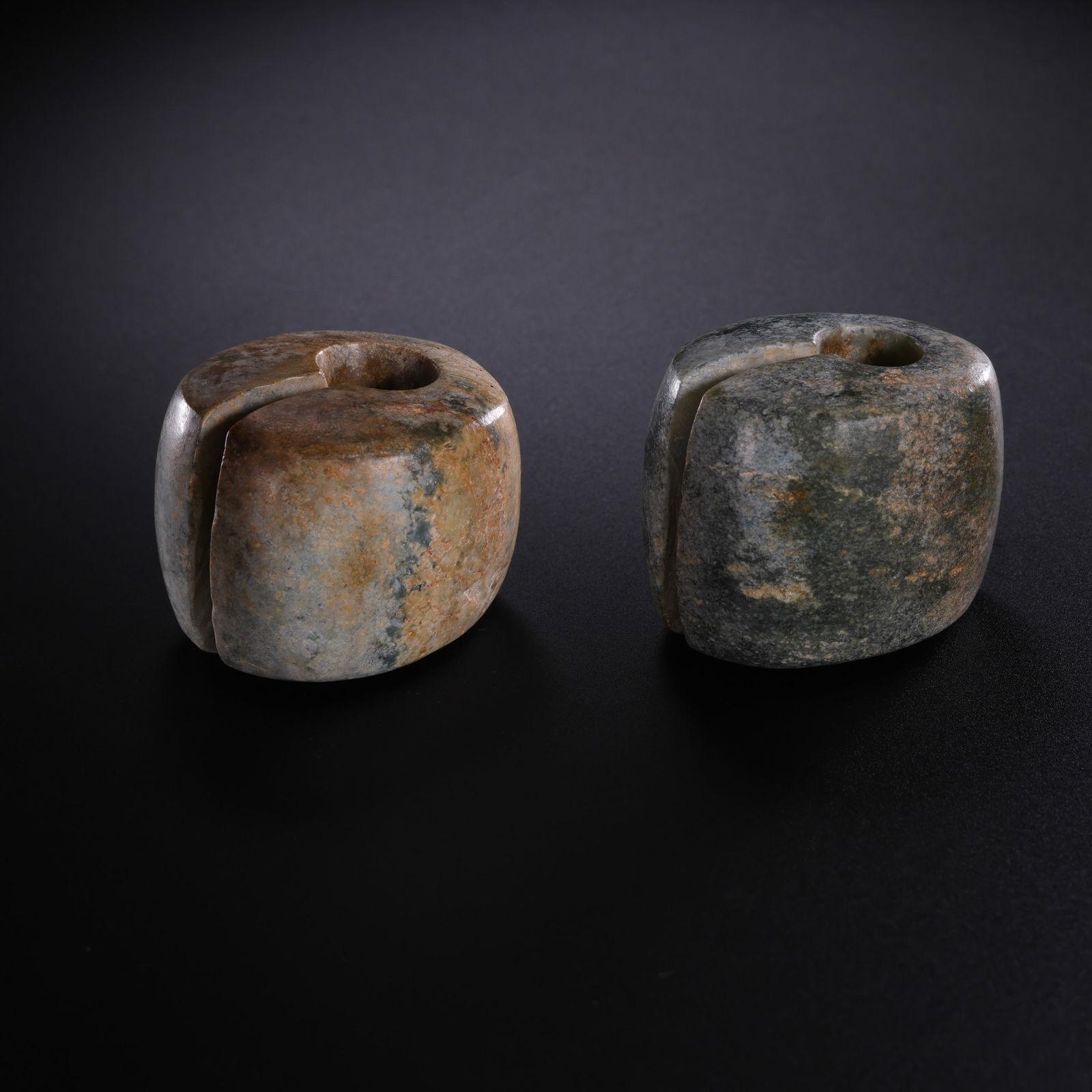 A pair of jade rings from the Hongshan culture of China’s Hongshan period: H. 3.8 cm. W. 4 cm. Weight 218.4 gram.Lot 458-525 is from the estate of Gottfried Otter in the UK. Gottfried Otter opened an antique shop in the UK in his early years. With the guidance of a Chinese a