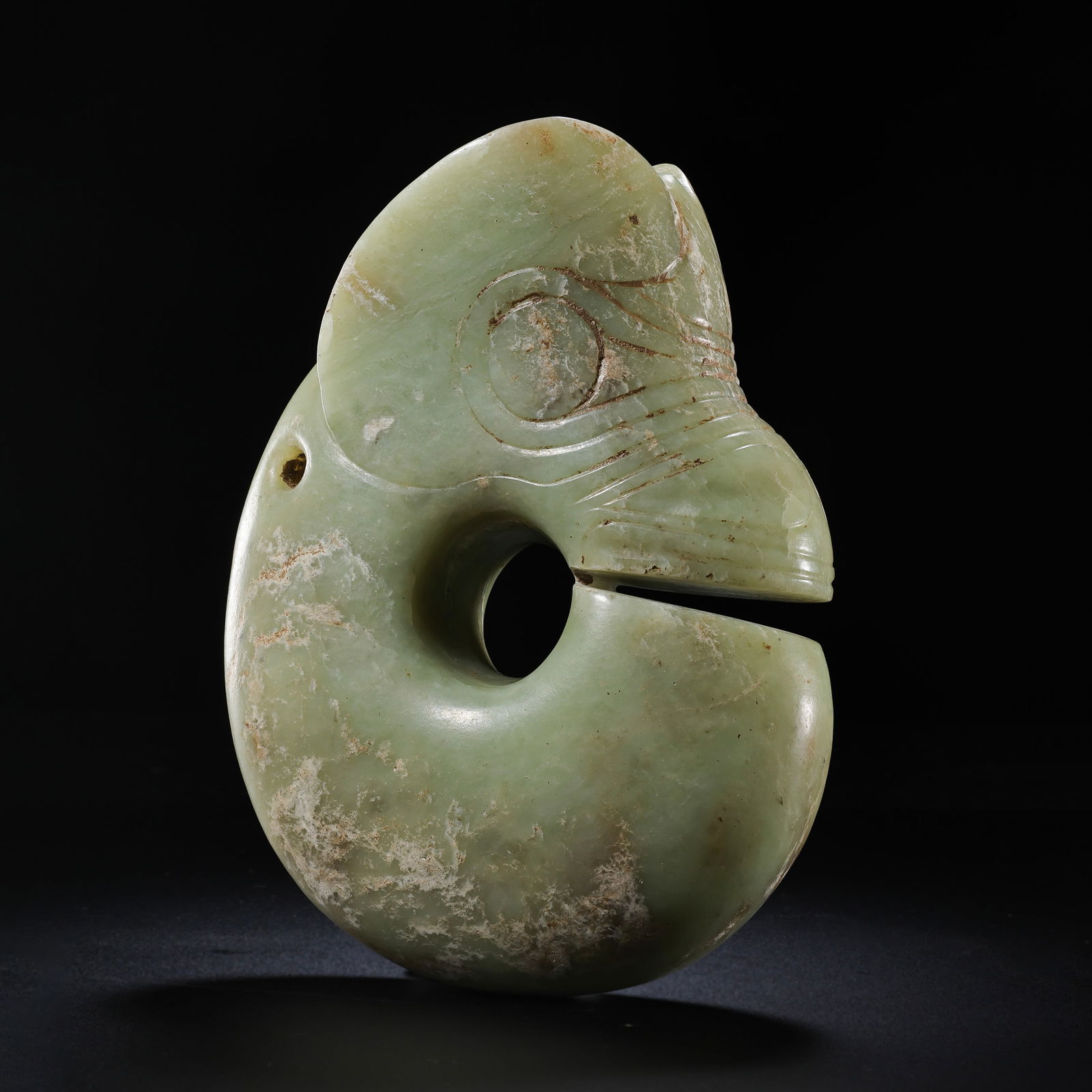 Jade Pig Dragon of Hongshan Culture during the Hongshan Period of China: H. 15.5 cm. W. 12.5 cm. Weight 1320 gram.Lot 458-525 is from the estate of Gottfried Otter in the UK. Gottfried Otter opened an antique shop in the UK in his early years. With the guidance of a Chines