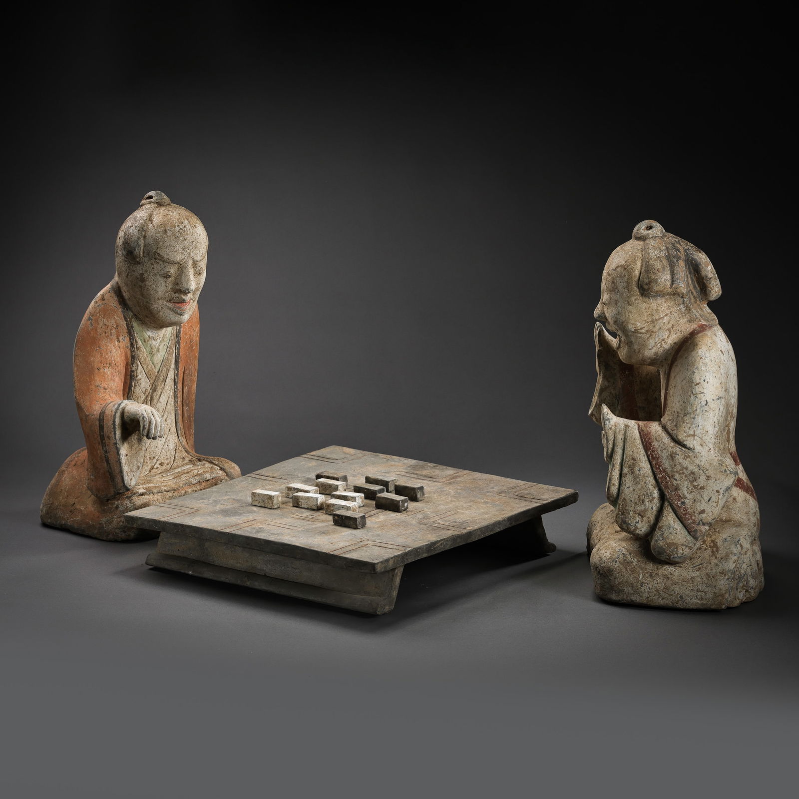 A SET OF CHINESE HAN DYNASTY COLORED CERAMIC CHESS FIGURINES (1 of 20)