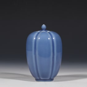 A Chinese blue-glazed melon-shaped lidded jar from the Kangxi period of the Qing Dynasty