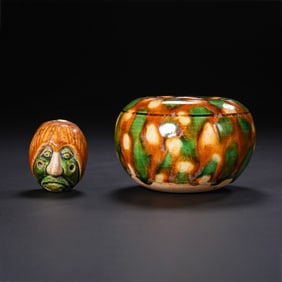 A set of Chinese Tang Dynasty tri-colored water jars and tri-colored human head medals