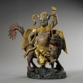 A Chinese Qing Dynasty Gilded Bronze Dapeng Buddha Statue