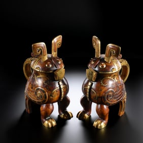 A pair of Chinese Han Dynasty gold-inlaid jade owl vases