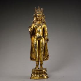 A Chinese Ming Dynasty Gilt Bronze and Gem-Inlaid Standing Buddha