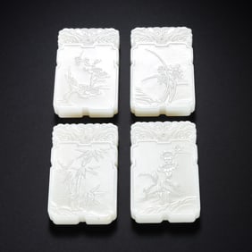 A set of Chinese Qing Dynasty Hotan white jade plum, orchid, bamboo and chrysanthemum plaques