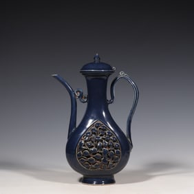 A Chinese Yuan Dynasty blue-glazed flower-patterned ewer